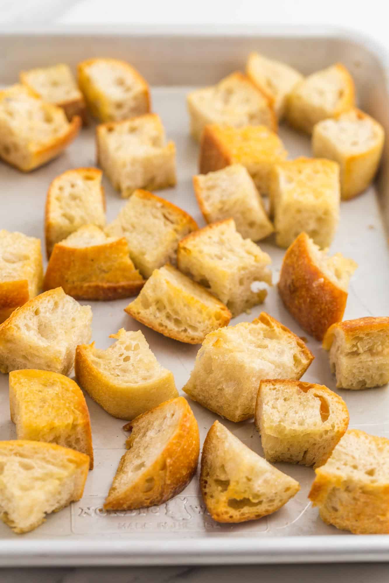 crispy bread cubes on a sheet pan