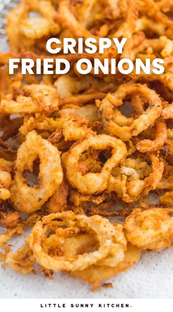 Crispy fried onions on a paper towel, and overlay text that says "Crispy fried onions"