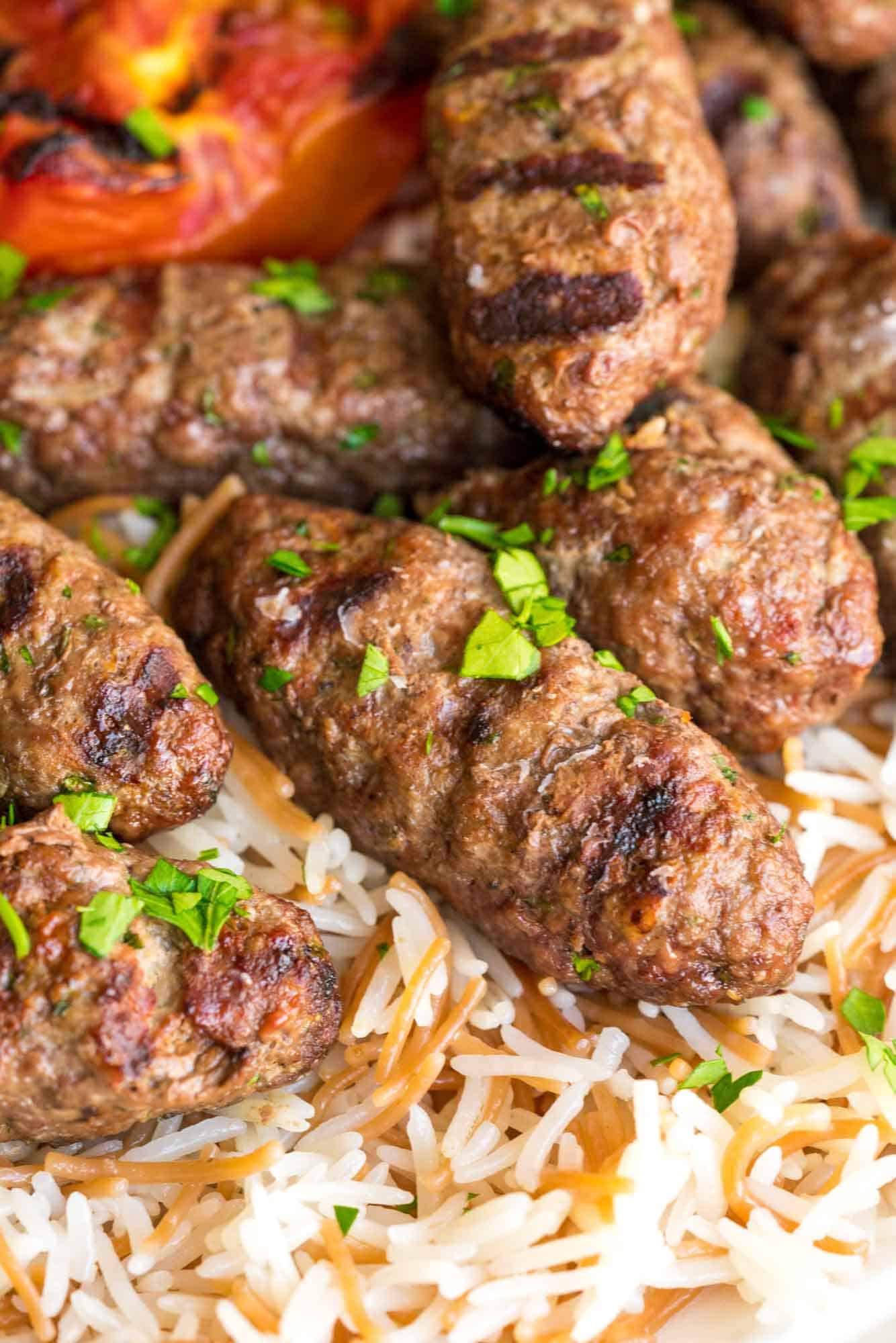 Close up shot of beef kafta served on a bed of rice