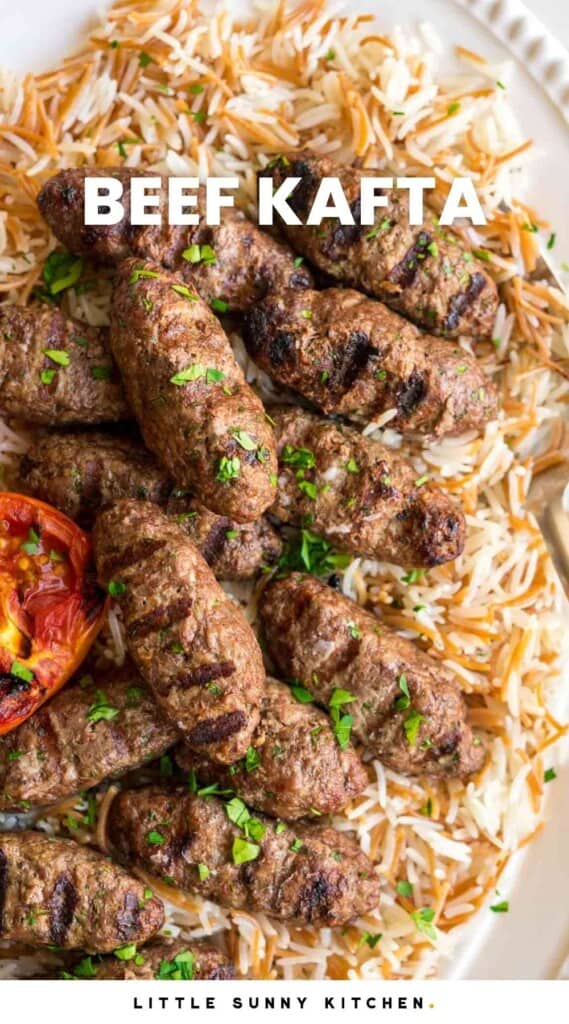 Close up shot of part of the platter with rice and kafta and grilled tomato half, and overlay text that says "Beef Kafta"