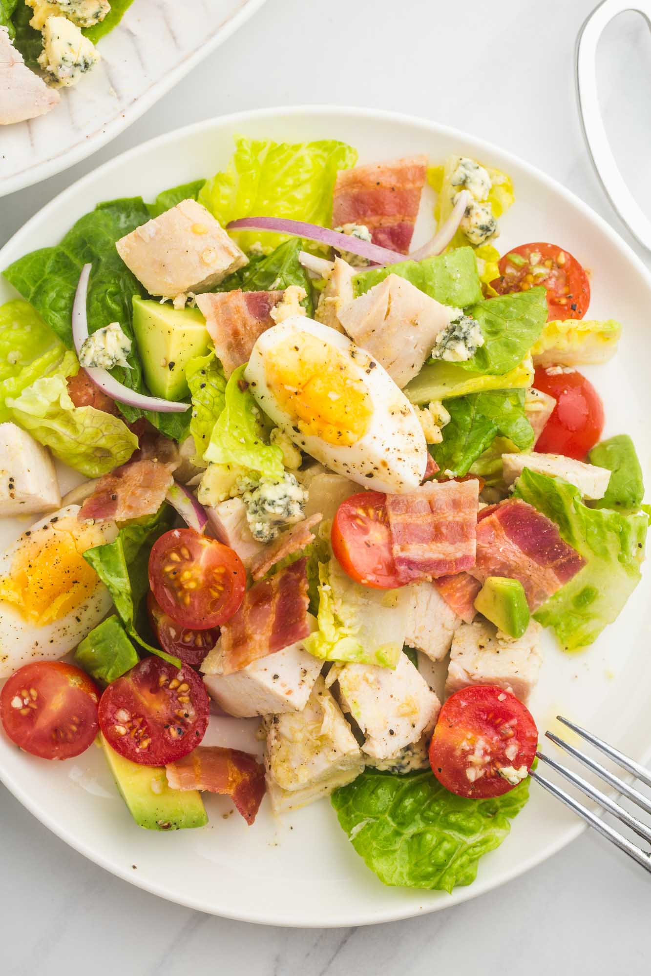 Cobb salad with chicken on a dinner plate