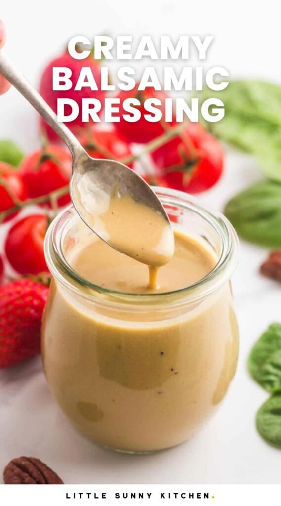 a small glass jar filled with creamy balsamic dressing