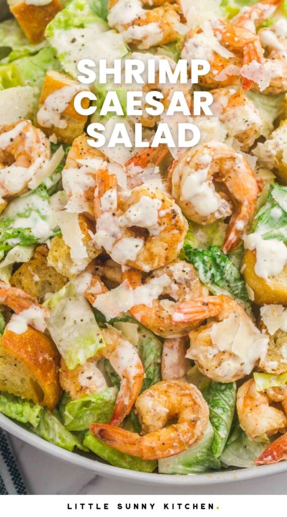 a bowl filled with shrimp Caesar Salad