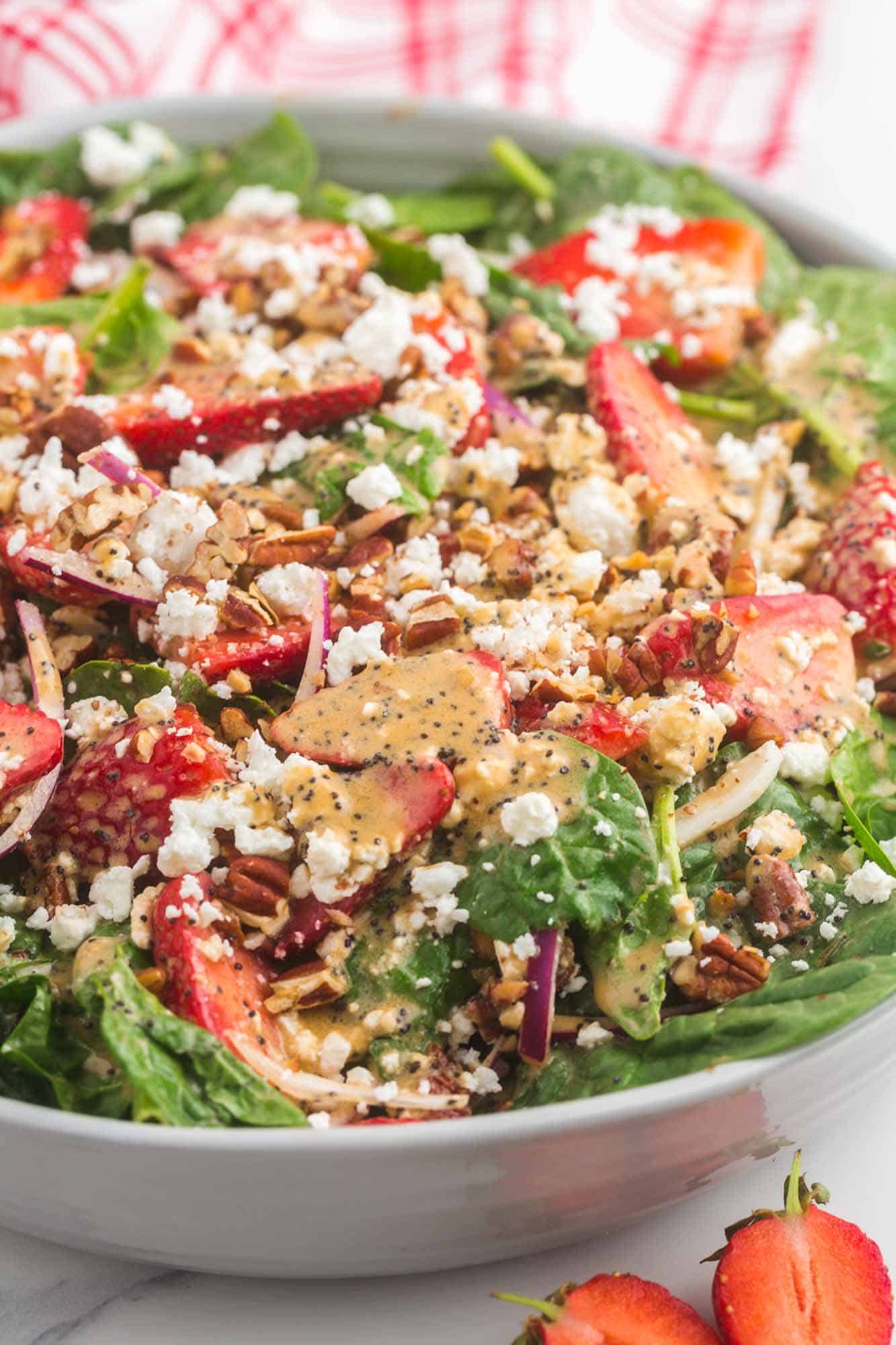 strawberry spinach salad tossed with poppyseed dressing
