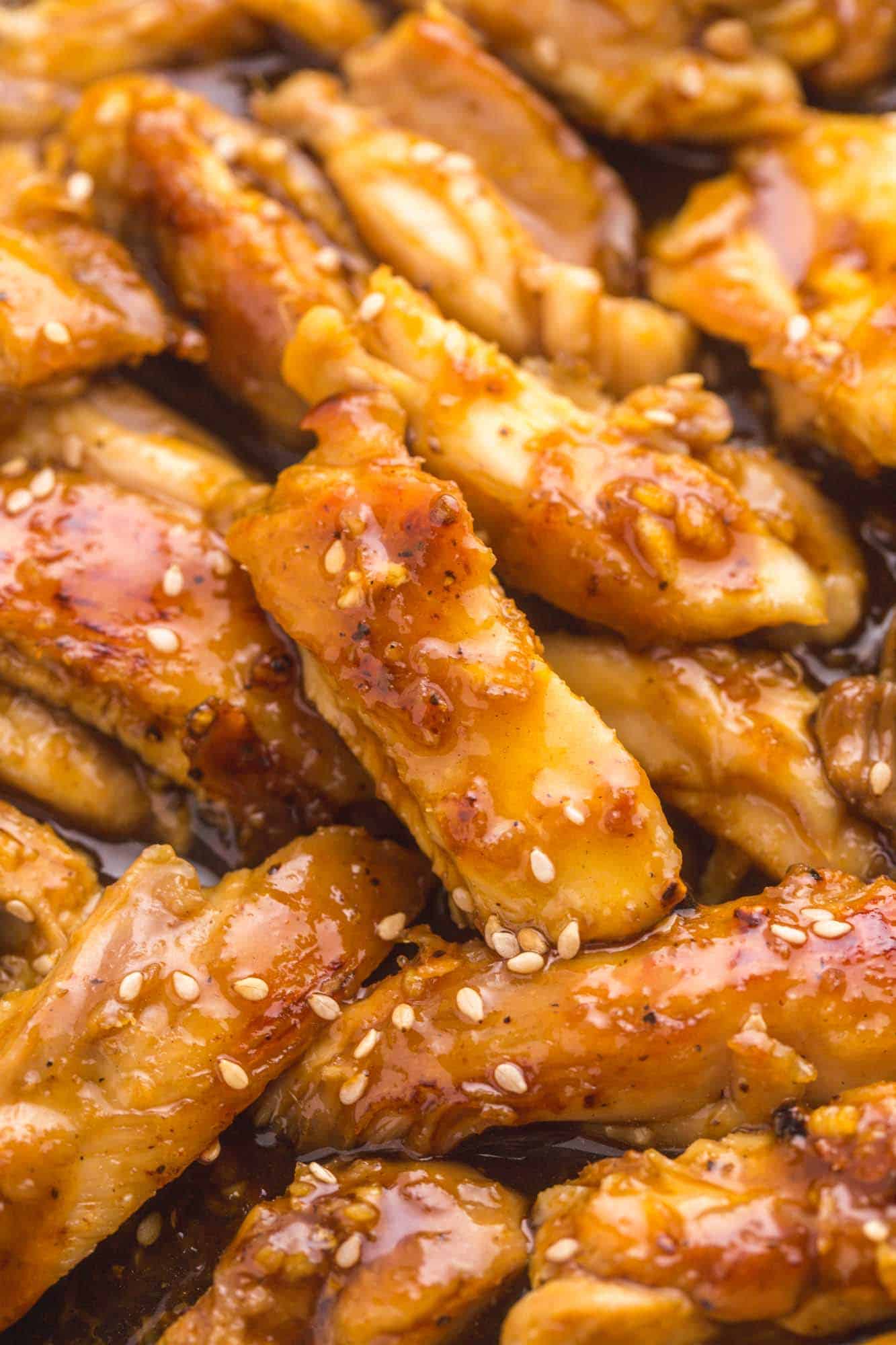 Closeup view of cooked teriyaki chicken thighs for rice bowls