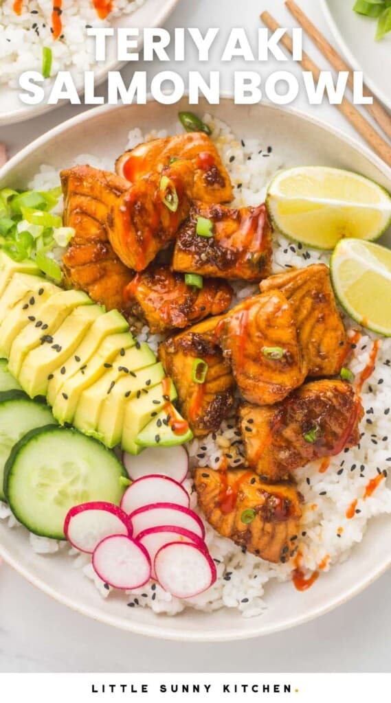 a neatly assembled teriyaki salmon rice bowl with avocado, cucumber, radish, and lime