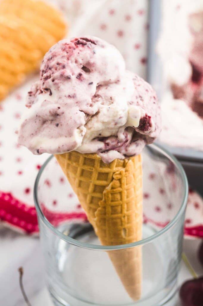 Cherry swirl icecream served on a waffle cone
