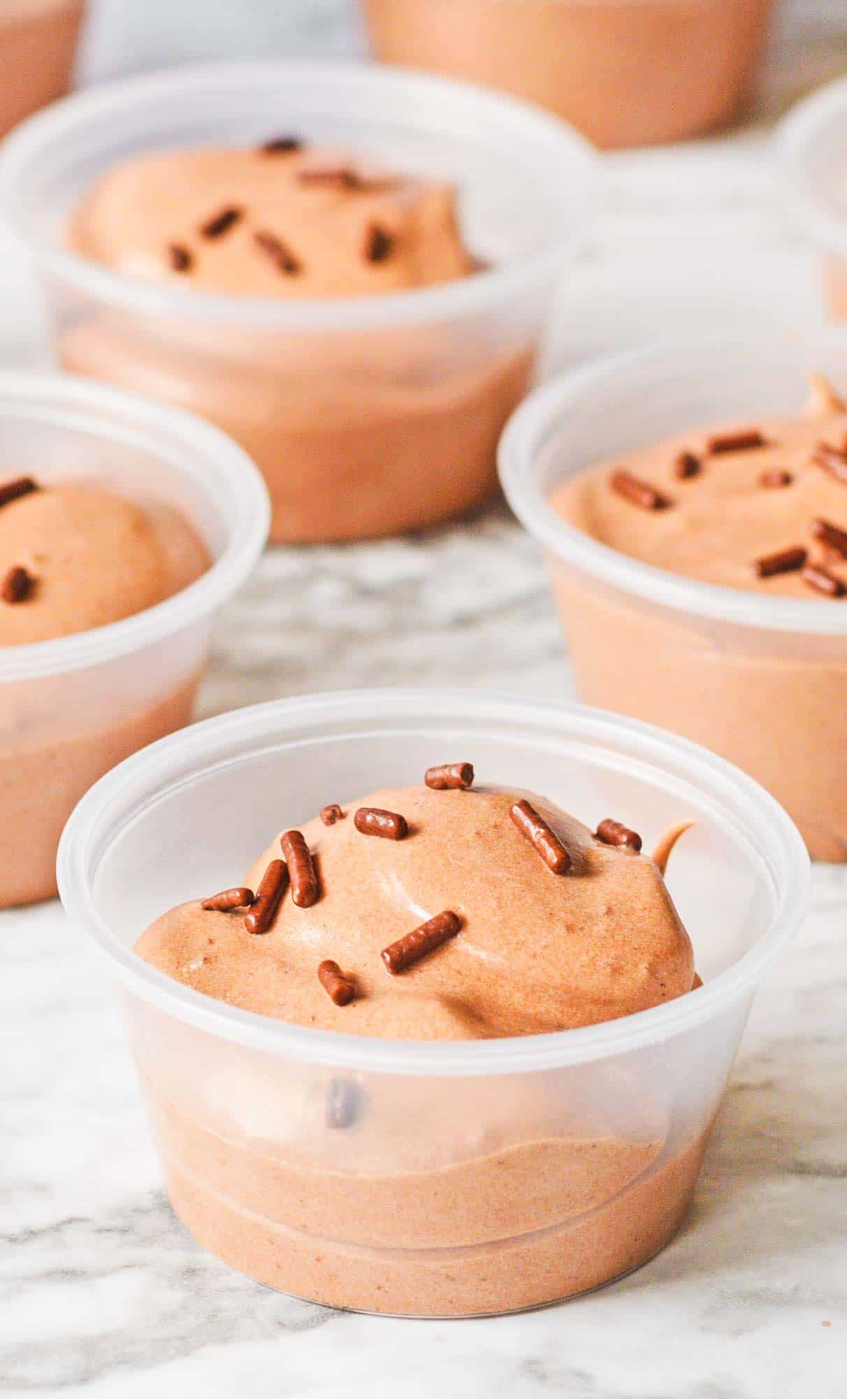chocolate pudding shots topped with sprinkles in 2 ounce portion cups