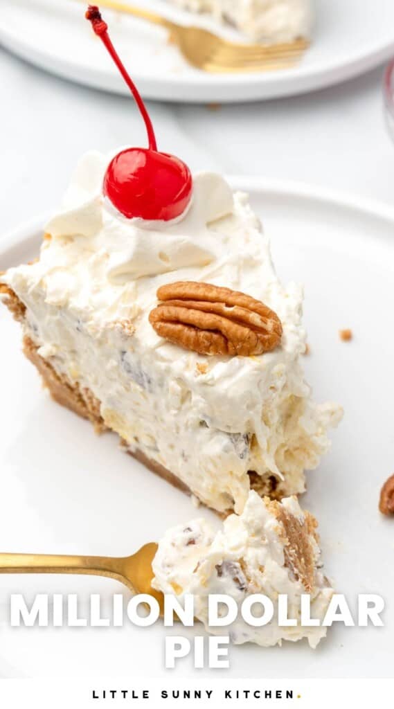 A slice of million dollar pie topped with a maraschino cherry and half a pecan, on a white plate with a bite taken by a gold fork. Text overlay says Million Dollar Pie.