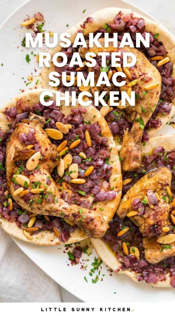 Overhead shot of musakhan chicken parts served on flatbreads with sumac onions. And overlay text that says "Musakhan roasted sumac chicken"