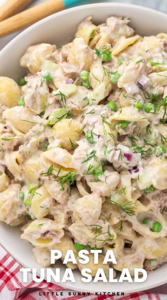 a closeup view of a large bowl of tuna pasta salad made with shells.