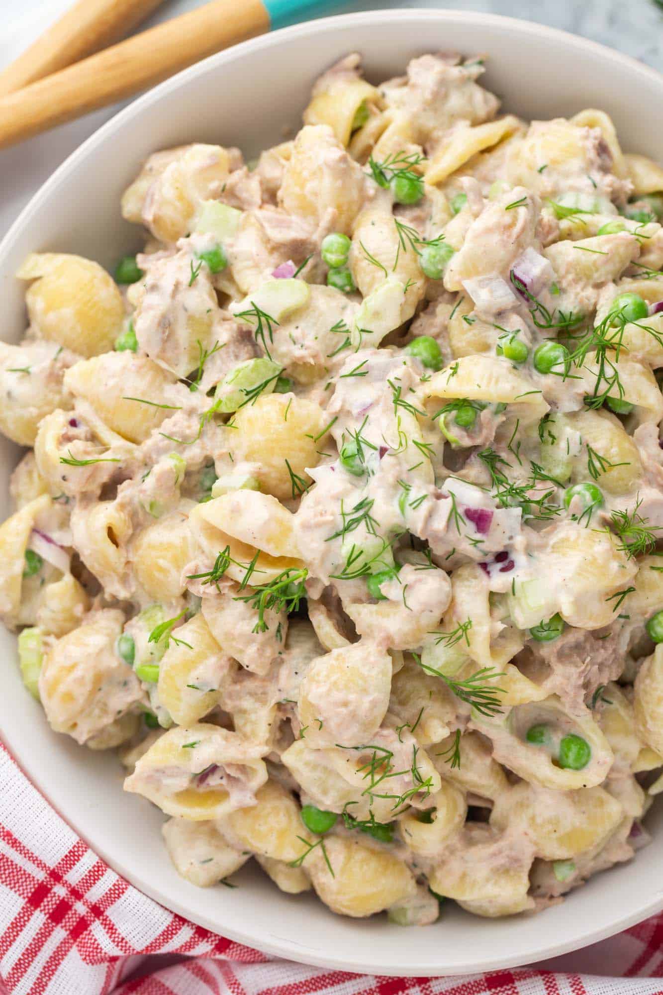 a closeup view of a large bowl of tuna pasta salad made with shells.