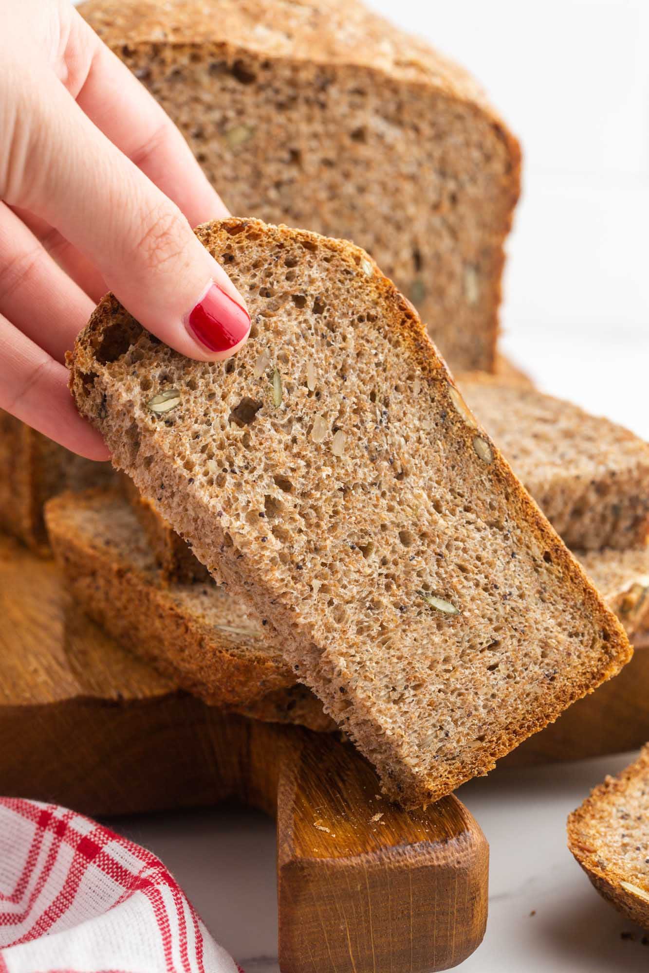 Holding a piece of seed bread