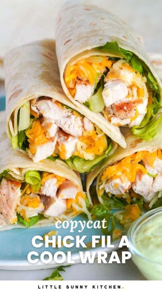 4 homemade grilled chicken cool wraps poiled on a plate with a side of avocado ranch. Text overlay titles the image Chick FIl A Cool Wrap