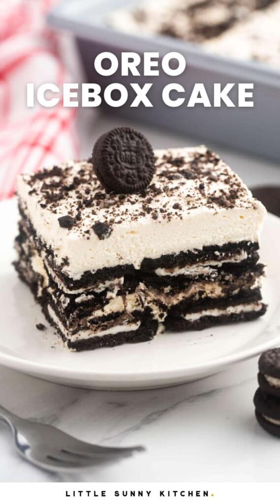 a square piece of layered oreo icebox cake with a miniature oreo on top.