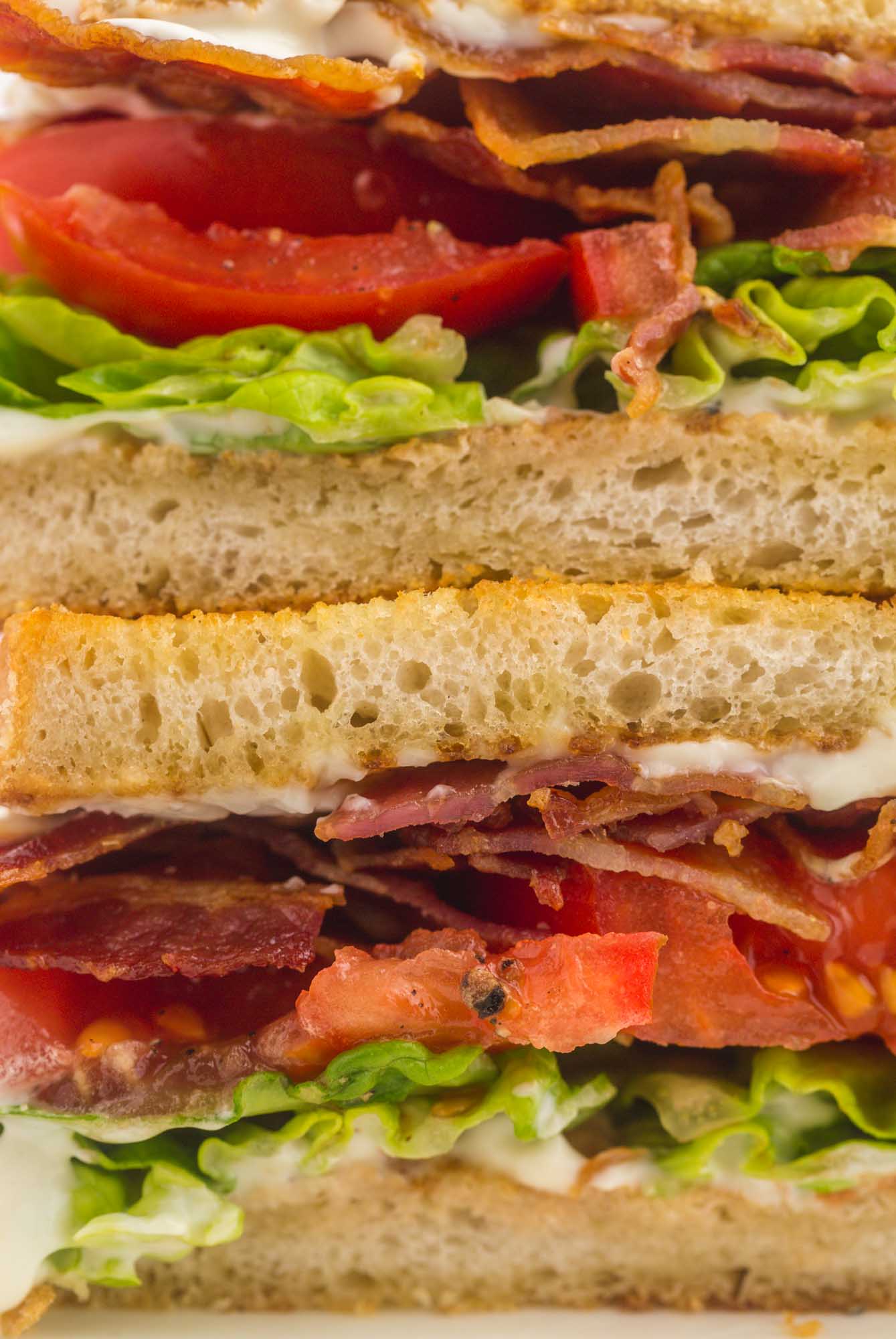 Close up shot of layers of a BLT sandwich