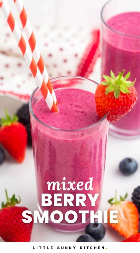 2 glasses with pink mixed berry smoothies, and fresh berries on the side. And overlay text that says "mixed berry smoothie"
