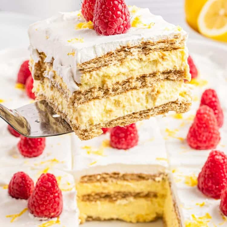 Taking a slice of lemon icebox cake from the pan