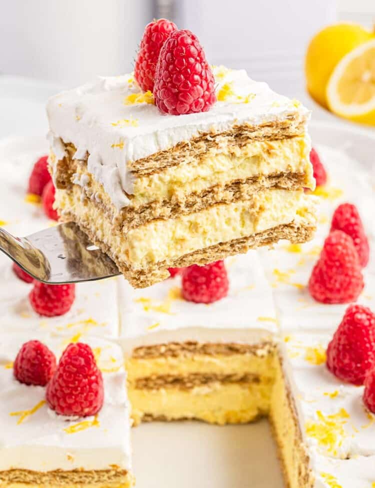 Taking a slice of lemon icebox cake from the pan