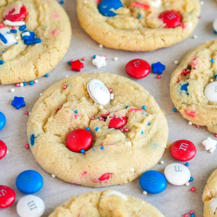 Close up shot of Red White And Blue M&M Cookie with patriotic M&M's and sprinkles around it