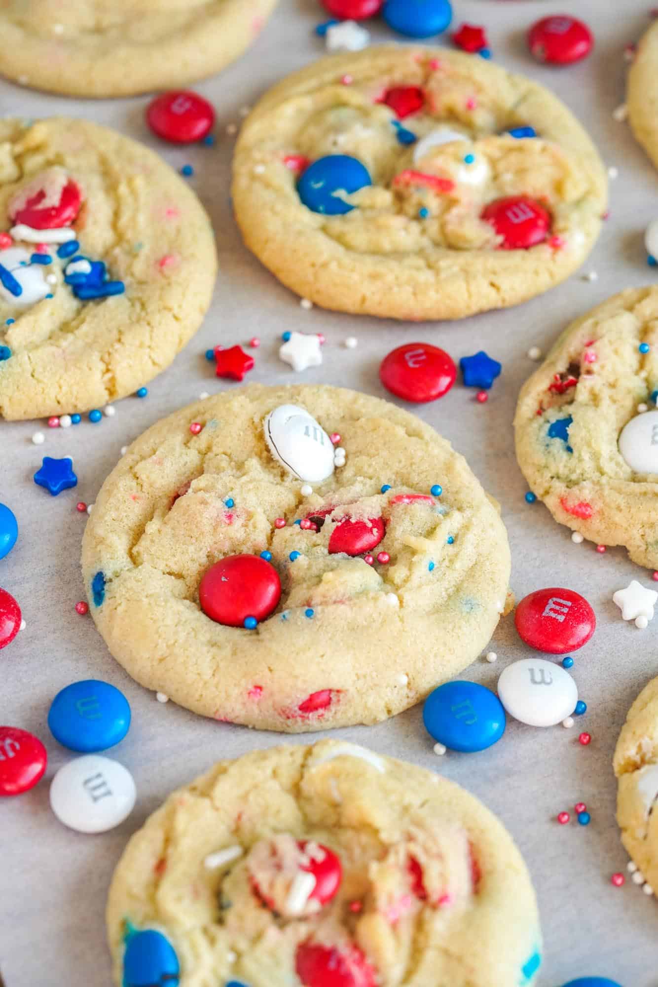 Close up shot of Red White And Blue M&M Cookie with patriotic M&M's and sprinkles around it