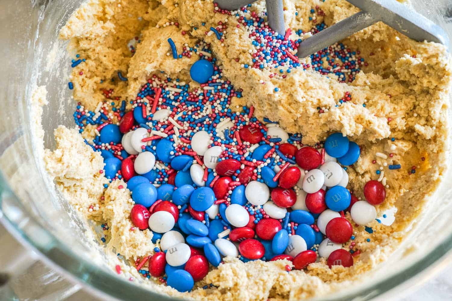Cookie dough with red white and blue M&M's and sprinkles