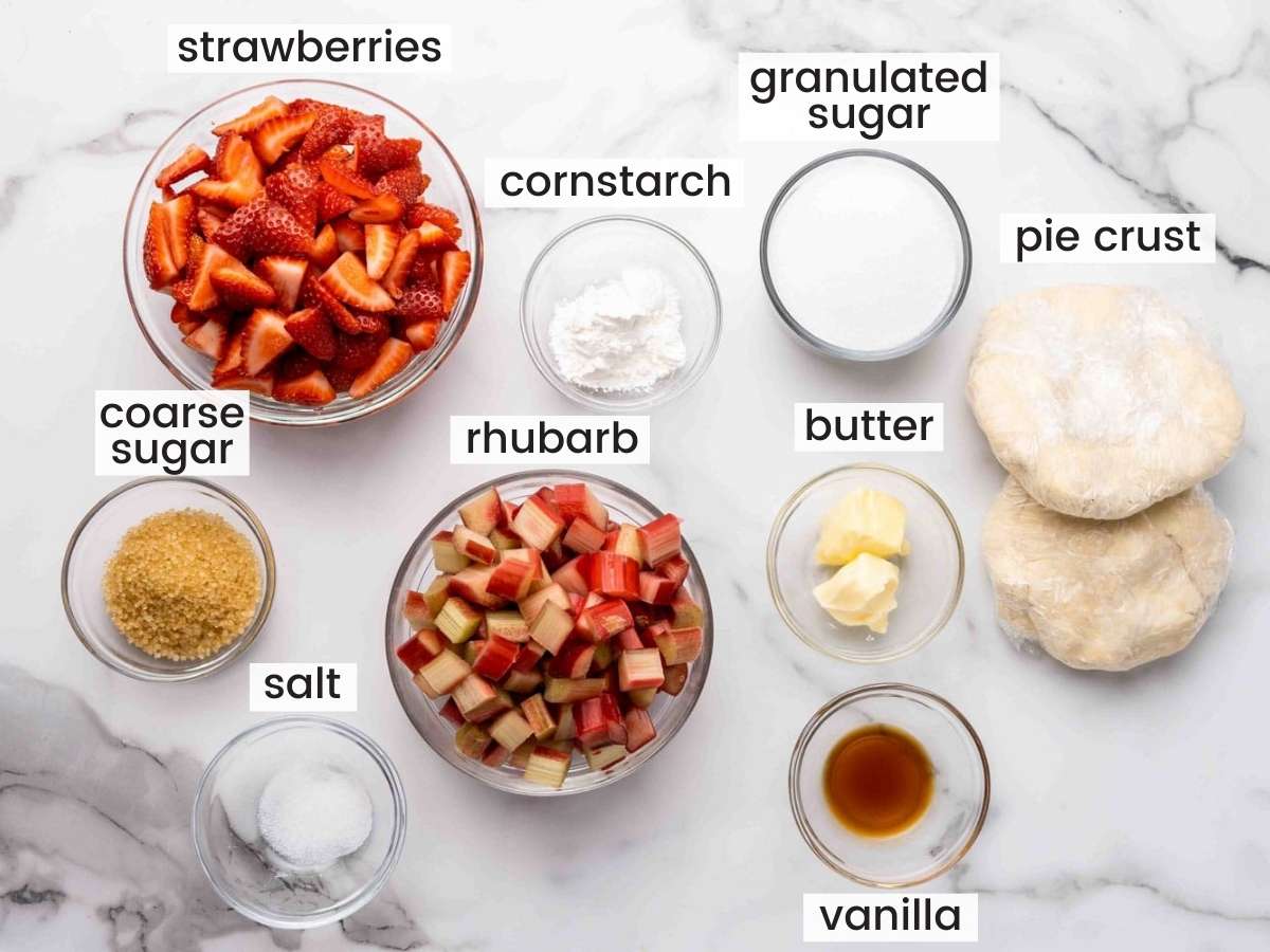 The ingredients needed to make strawberry rhubarb pie, measured into small bowls
