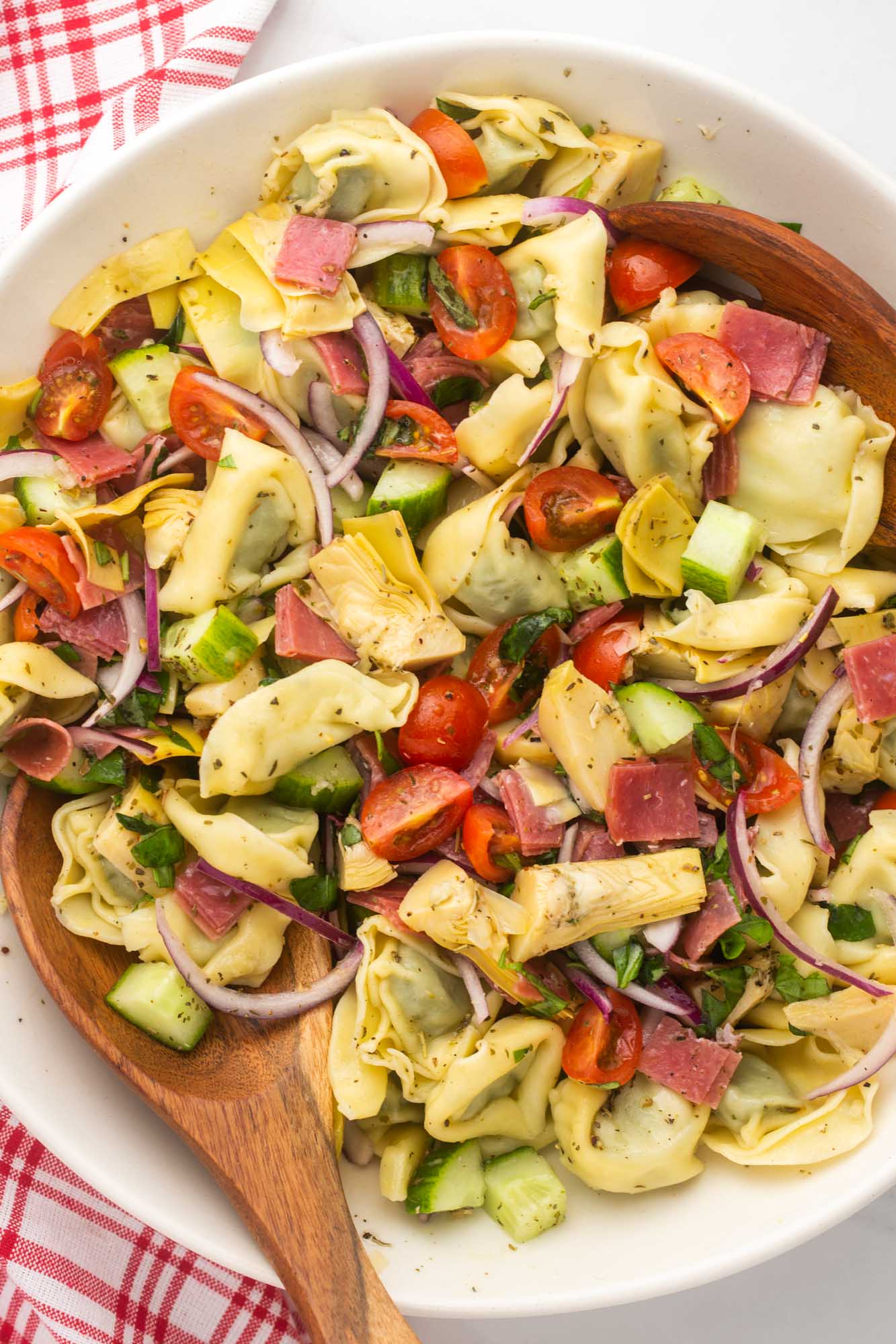 a large bowl of tortellini pasta salad viewed from above