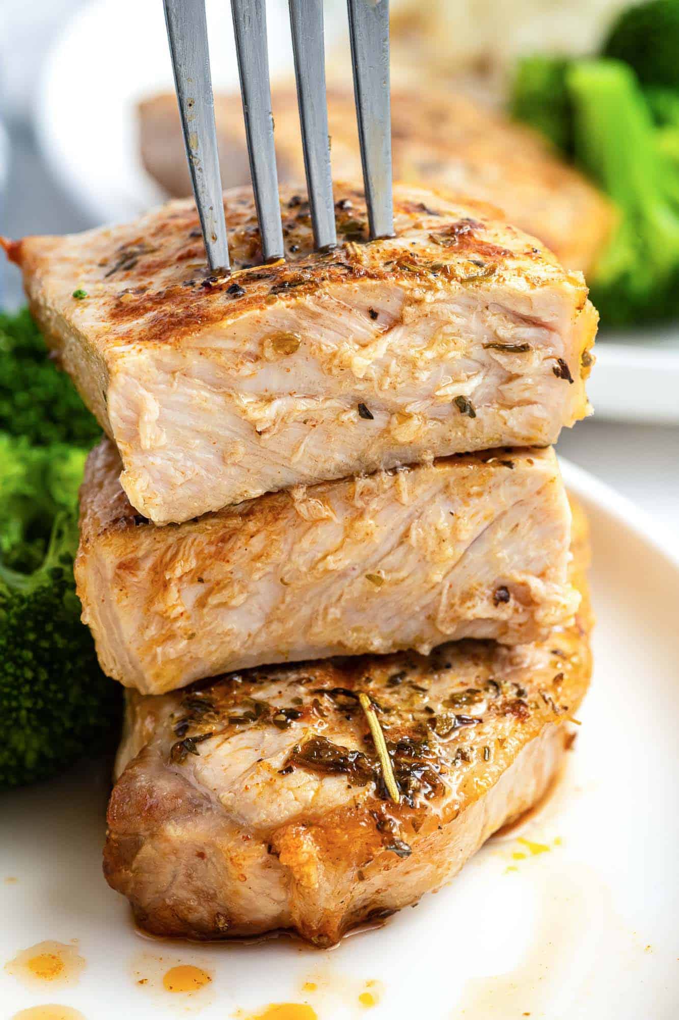 Close up shot of sliced air fried pork chop and a fork