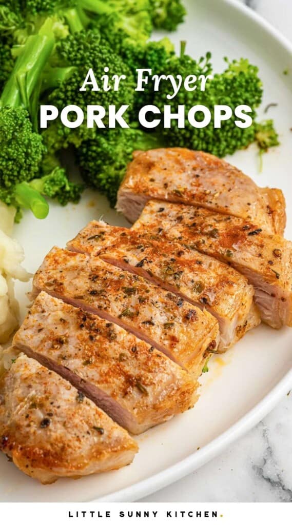 Sliced air fried pork chop on a white plate, served with mashed potatoes and steamed broccoli, with overlay text that says "Air Fryer pork chops"