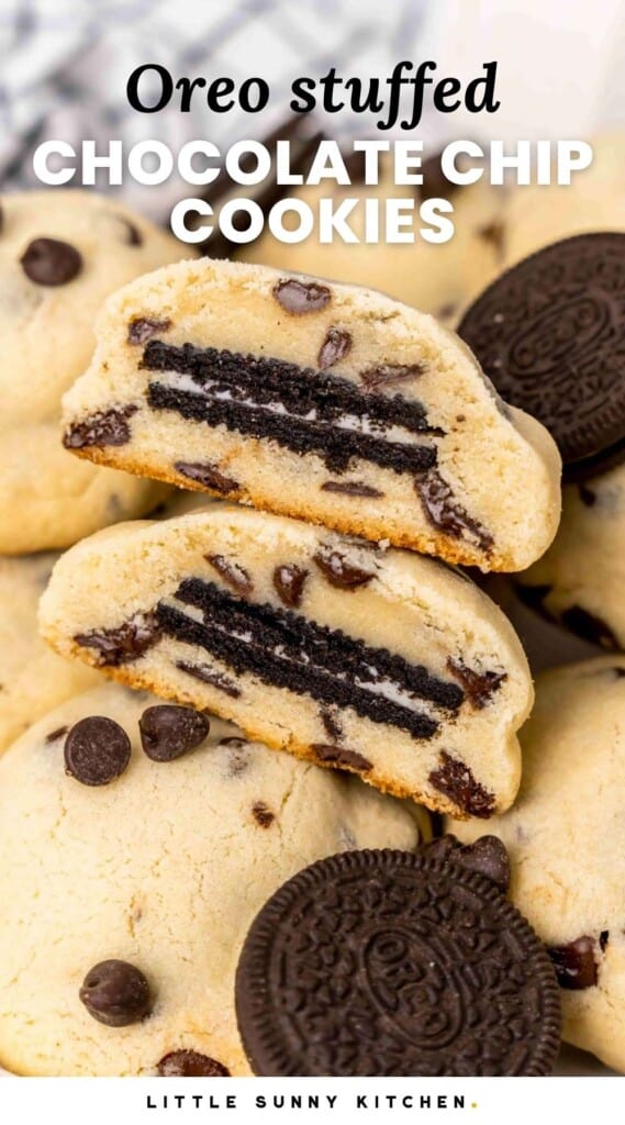 Thick chocolate chip cookies with Oreos inside. One is cut in half to show what it looks like in the middle.