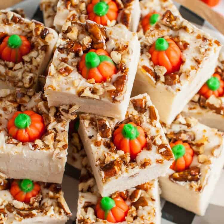 Pumpkin spice fudge squares stacked on a plate