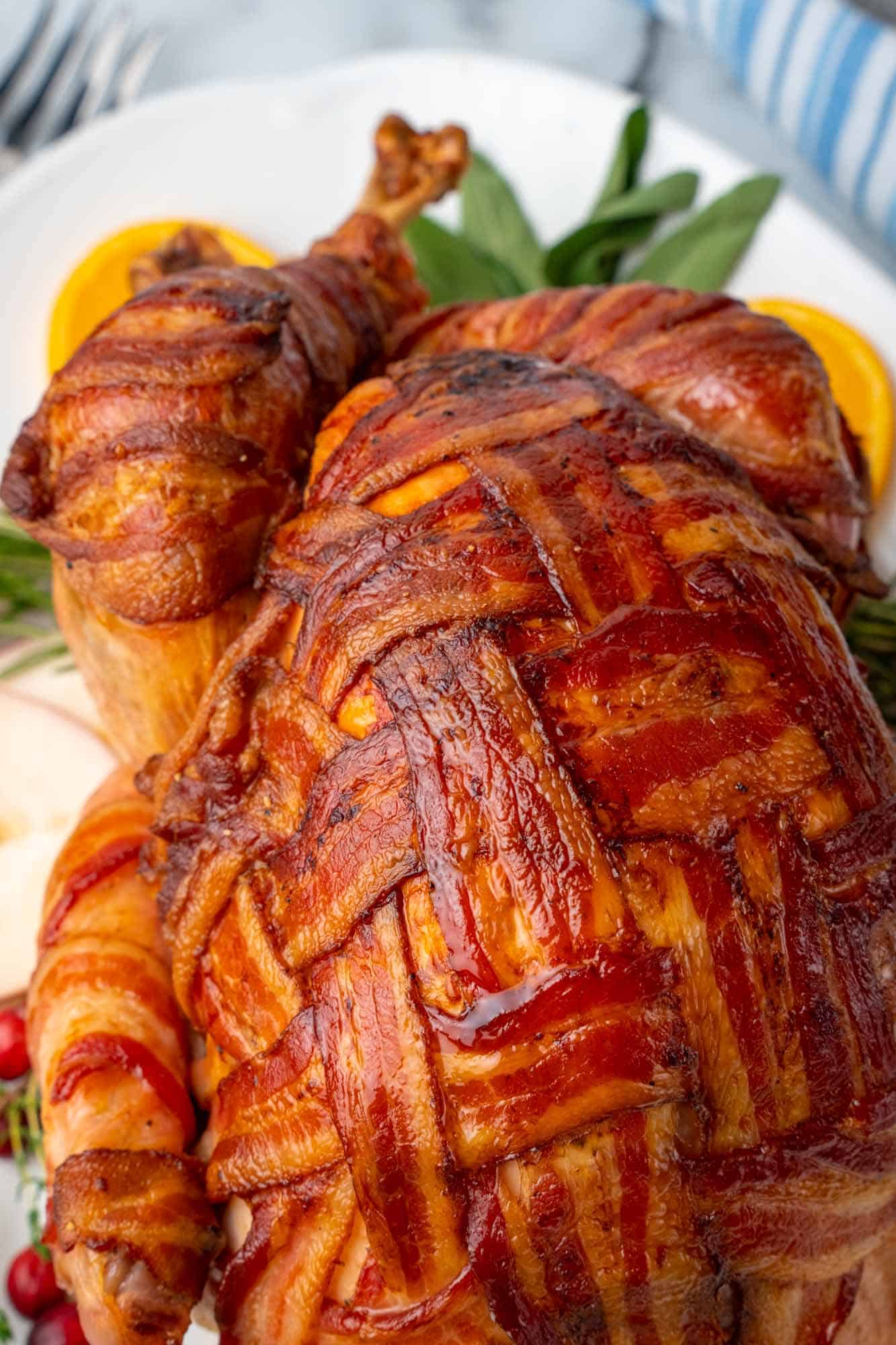 closeup view of a bacon wrapped roast turkey
