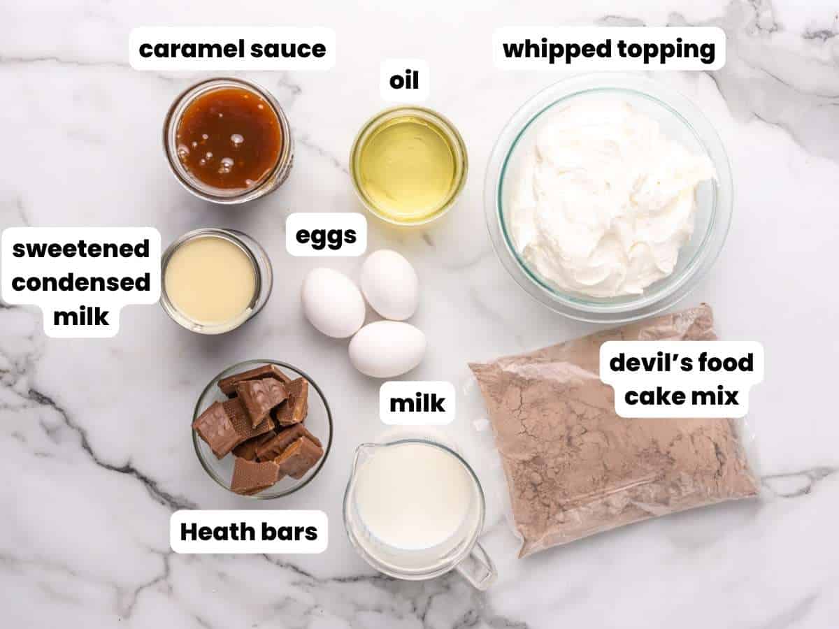 The ingredients for making better than sex cake with boxed cake mix, cool whip, and heath bars