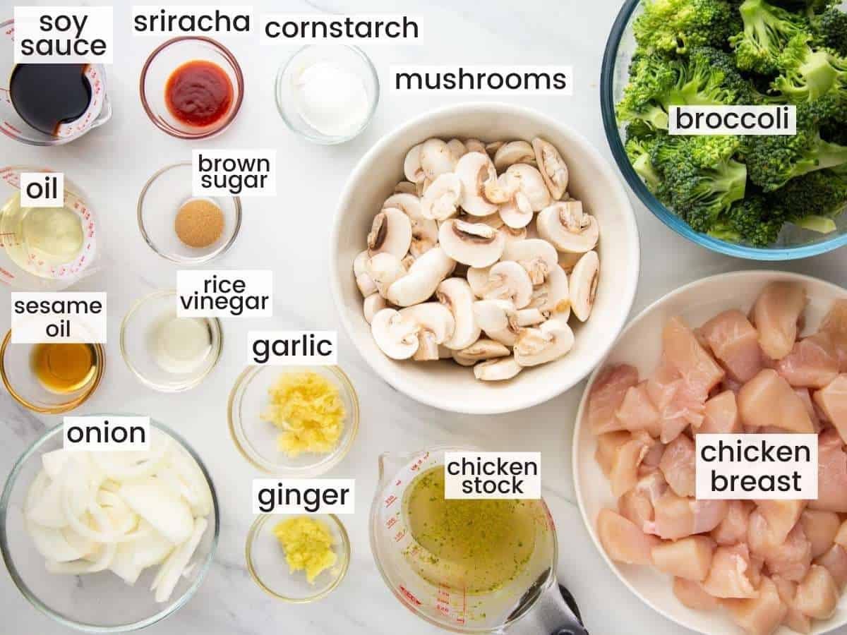 The ingredients in chicken and broccoli sir fry, all in separate bowls, viewed from above