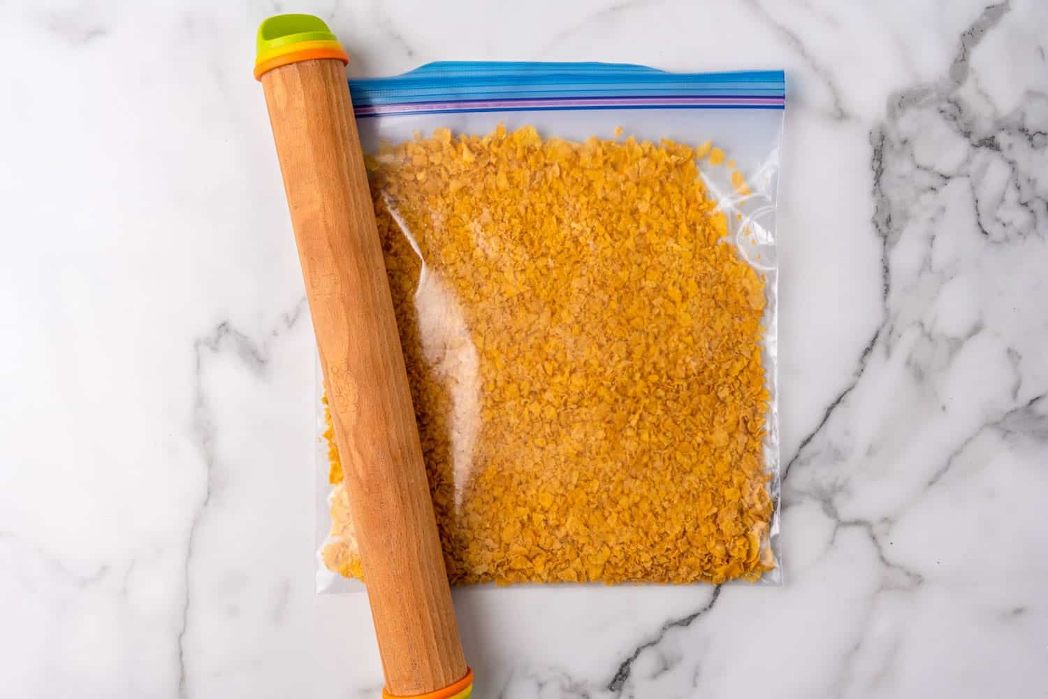 a ziplock bag of cornflakes crushed with a straight rolling pin
