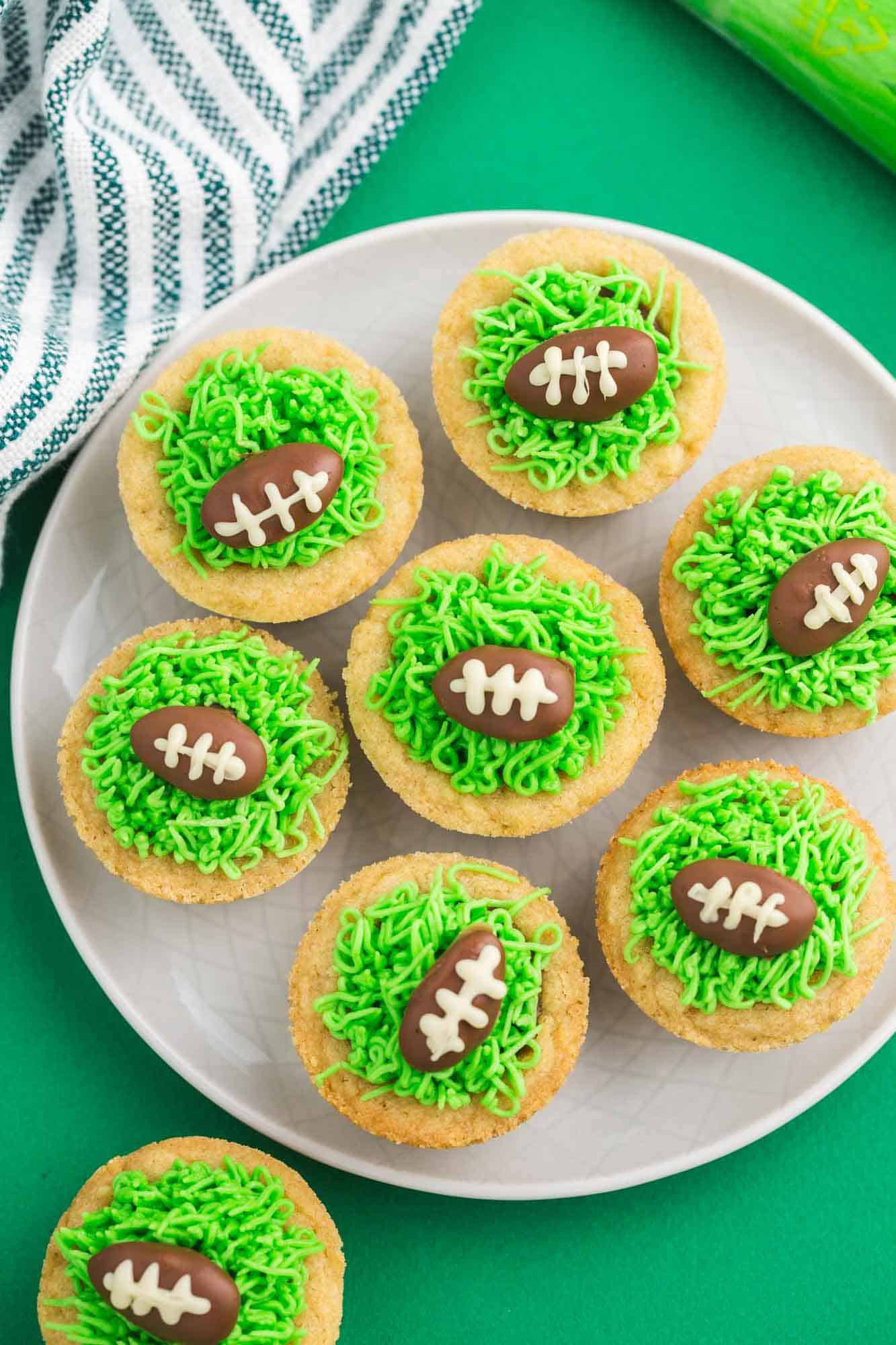 Overhead shot of football cookie cups placed on a plate
