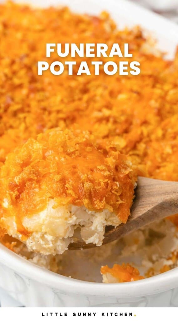 a white casserole dish filled with funeral potatoes with a cornflake topping. Text overlay says "funeral potatoes"