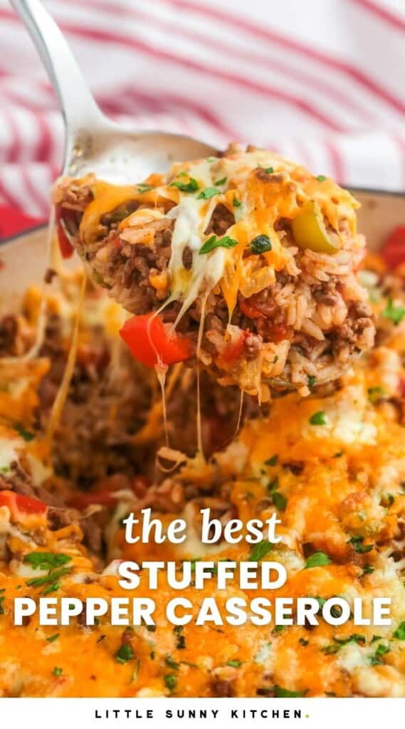 stuffed pepper casserole in a skillet. A spoon is lifting up a serving showing melty cheese. Text overlay says "the best stuffed pepper casserole"