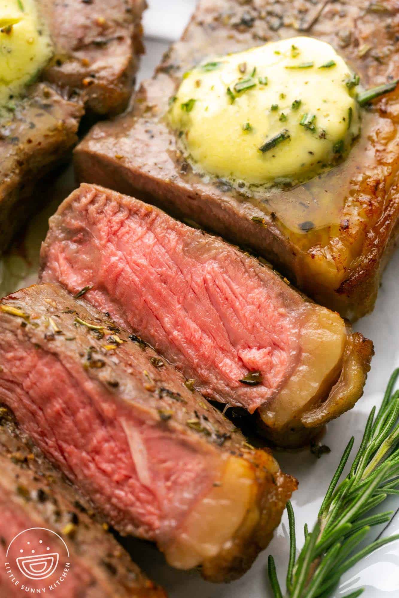 Close up shot of sliced sirloin steak with herb butter