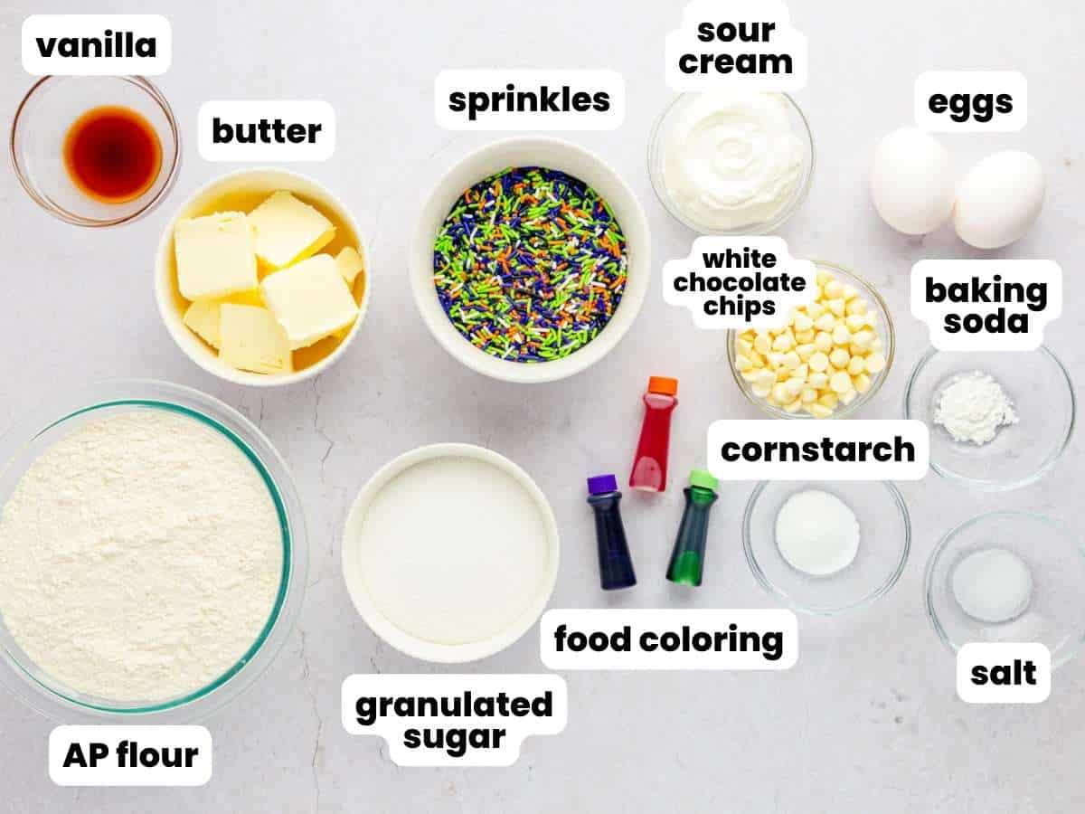 The ingredients needed to make soft sugar cookies dyed with hocus pocus colors.