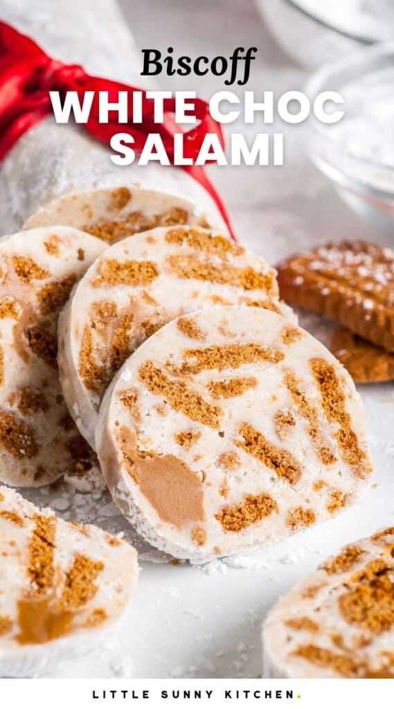 Sliced white chocolate salami with biscoff cookie pieces. Text at top of image says "biscoff white chocolate salami"