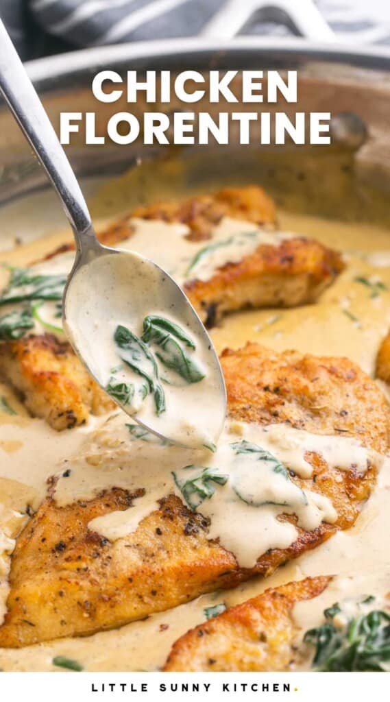 A spoon adding sauce to a chicken florentine cutlet in a pan with spinach.