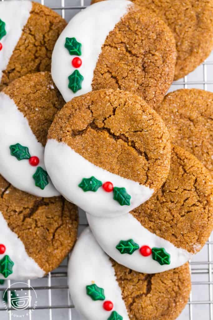 Overhead shot of decorated gingersnap cookies on a wire rack