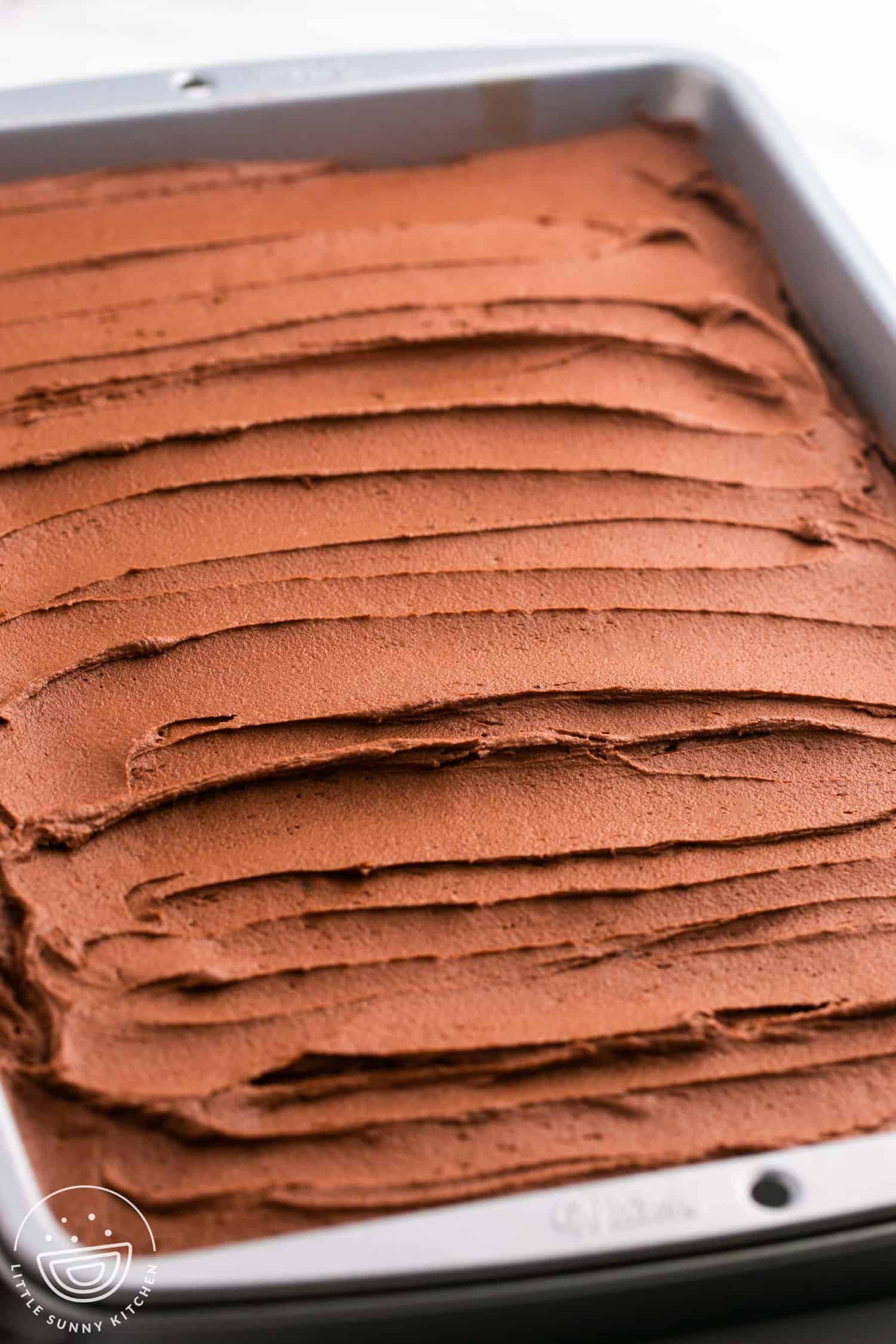 chocolate mayonnaise cake with chocolate frosting in a pan, unsliced. 