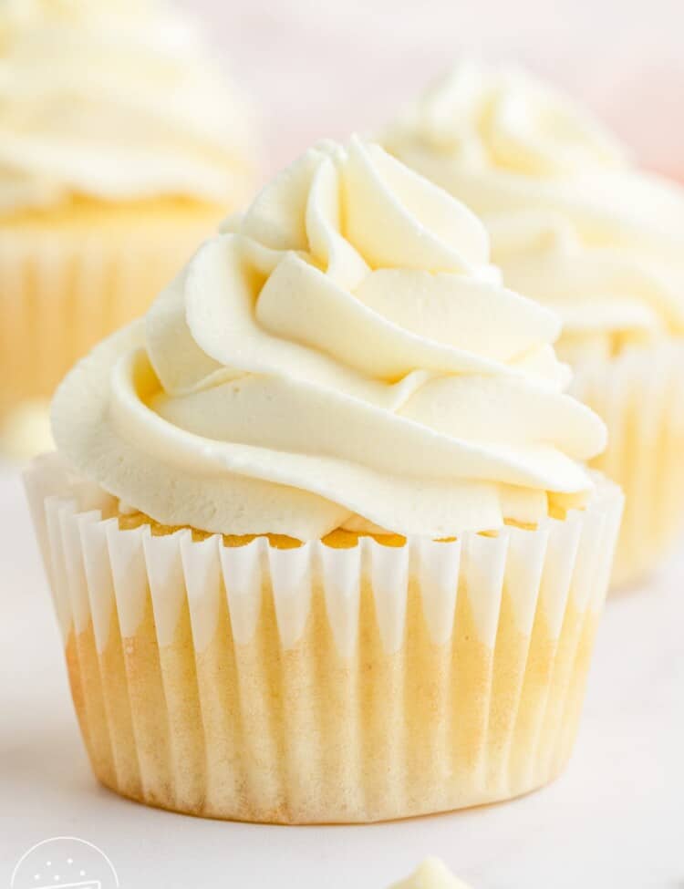 A cupcake frosted with white chocolate buttercream
