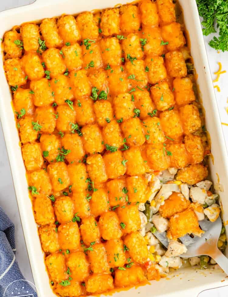 Overhead shot of a chicken tater tot casserole in a 9x13 inch dish
