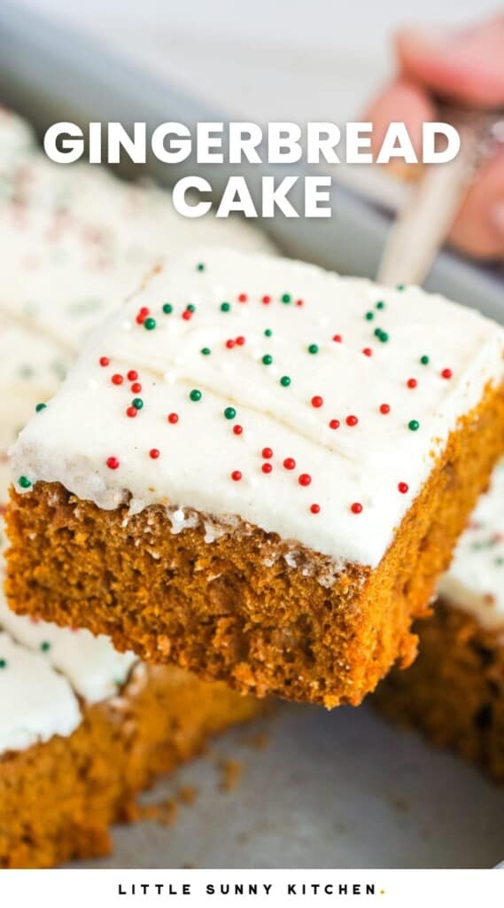 a square piece of gingerbread cake topped with frosting and holiday sprinkles. Text overlay says "gingerbread cake"