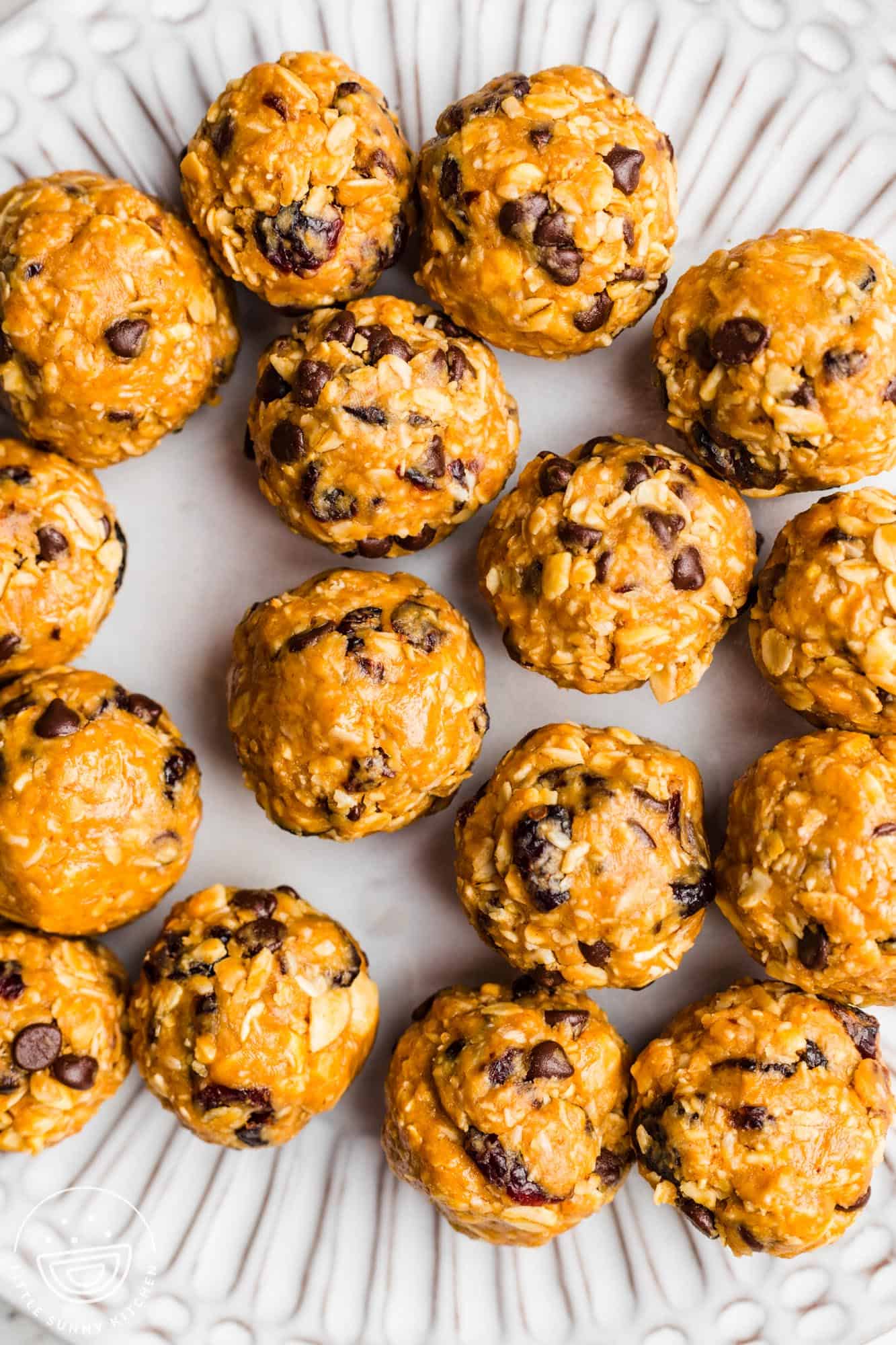 oatmeal balls with mini chocolate chips on a plate, viewed from above.