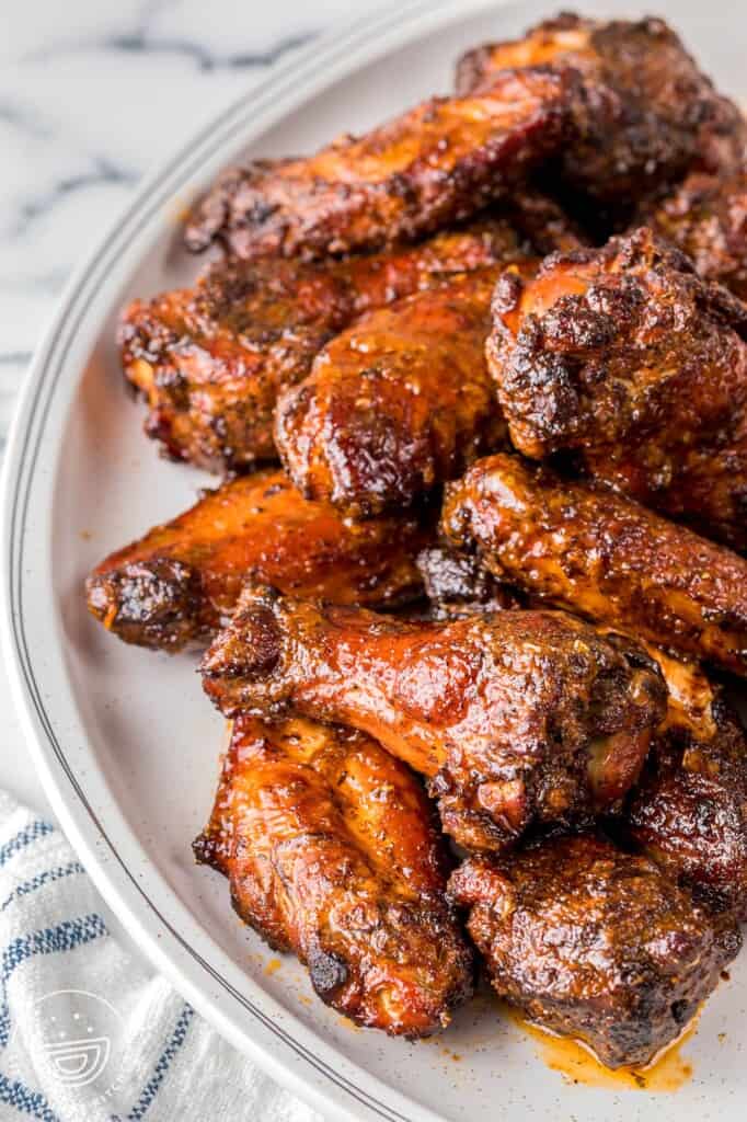 Smoked chicken wings served on a white platter